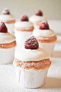 Angel Food Cupcakes with sweetened cream and raspberries | by Carrie Sellman for TheCakeBlog.com