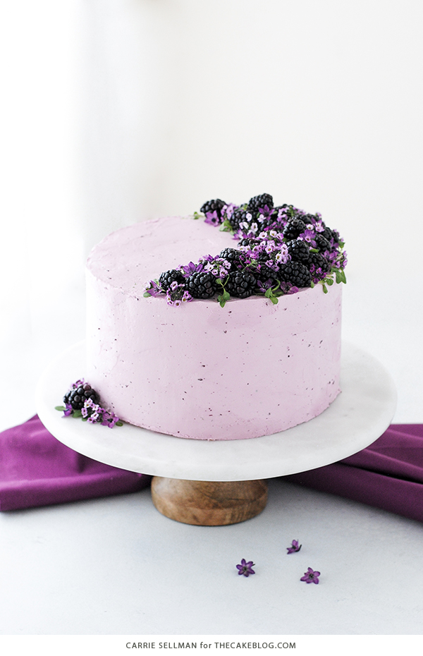 Blackberry Lime Cake - tender cake infused with lime zest, frosted with blackberry buttercream, topped with fresh blackberries and edible flowers | by Carrie Sellman for TheCakeBlog.com
