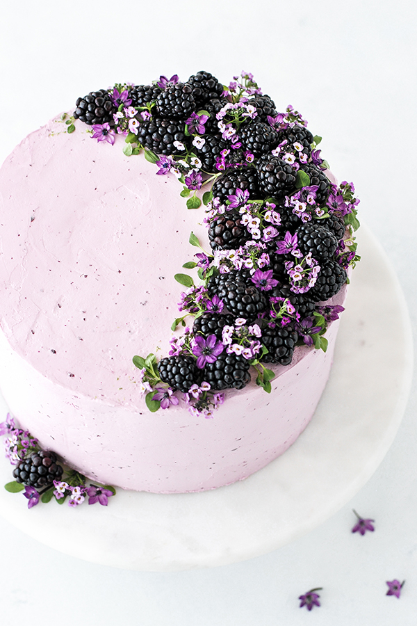 Blackberry Lime Cake - tender cake infused with lime zest, frosted with blackberry buttercream, topped with fresh blackberries and edible flowers | by Carrie Sellman for TheCakeBlog.com