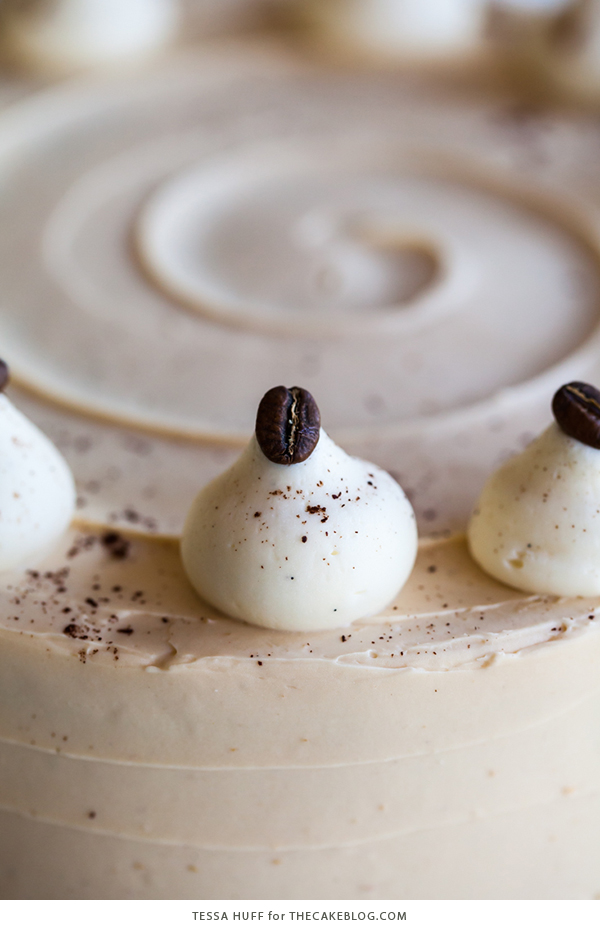 Caramel Cappuccino Cake - espresso cake paired with caramel buttercream frosting, topped with whole coffee beans and a sprinkle of cocoa powder | by Tessa Huff for TheCakeBlog.com
