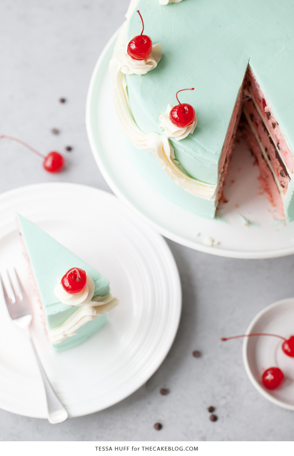 Cherry Chip Cake - maraschino cherry cake studded with chocolate chips, layered with chocolate ganache and finished with a whipped vanilla buttercream frosting | by Tessa Huff for TheCakeBlog.com