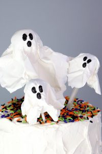 Chocolate Lollipop Ghosts - how to make edible lollipop ghosts for Halloween cakes and cupcakes using white chocolate and suckers | by Erin Gardner for TheCakeBlog.com