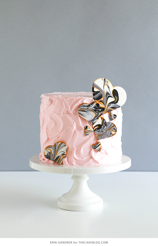 Marble Chocolate Hearts - how to make marbled heart toppers for cakes and cupcakes using chocolate coating and cookie cutters | by Erin Gardner for TheCakeBlog.com