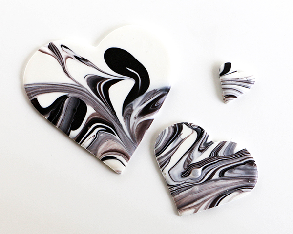 Marble Chocolate Hearts - how to make marbled heart toppers for cakes and cupcakes using chocolate coating and cookie cutters | by Erin Gardner for TheCakeBlog.com