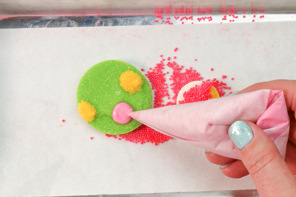 Sprinkle Ornament Cake – how to make sparkling ornaments for cakes and cupcakes using chocolate, cookie cutters and sprinkles | by Erin Gardner for TheCakeBlog.com