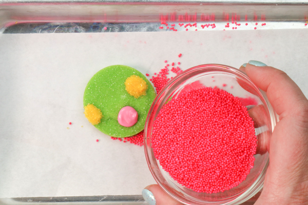 Sprinkle Ornament Cake – how to make sparkling ornaments for cakes and cupcakes using chocolate, cookie cutters and sprinkles | by Erin Gardner for TheCakeBlog.com