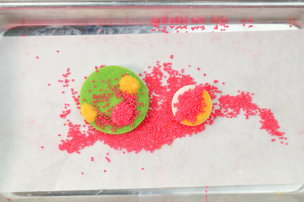 Sprinkle Ornament Cake – how to make sparkling ornaments for cakes and cupcakes using chocolate, cookie cutters and sprinkles | by Erin Gardner for TheCakeBlog.com