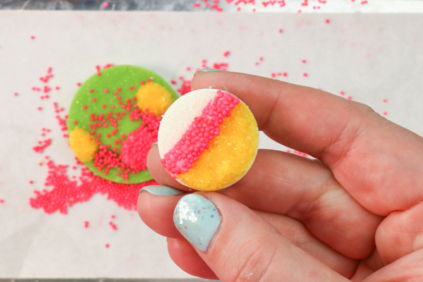 Sprinkle Ornament Cake – how to make sparkling ornaments for cakes and cupcakes using chocolate, cookie cutters and sprinkles | by Erin Gardner for TheCakeBlog.com