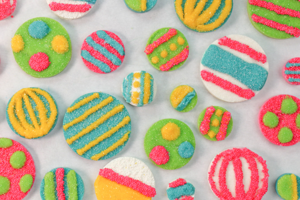 Sprinkle Ornament Cake – how to make sparkling ornaments for cakes and cupcakes using chocolate, cookie cutters and sprinkles | by Erin Gardner for TheCakeBlog.com