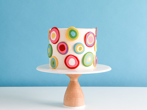 Mod Polka Dot Cake - how to make colorful polka dot toppers for cakes and cupcakes using chocolate coating | Erin Gardner for TheCakeBlog.com