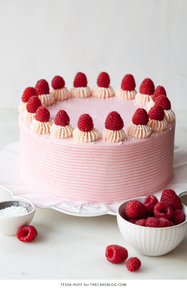 Chocolate Raspberry Cake - moist chocolate cake layered with raspberry jam, topped with raspberry cheesecake frosting and fresh red raspberries | by Tessa Huff for TheCakeBlog.com