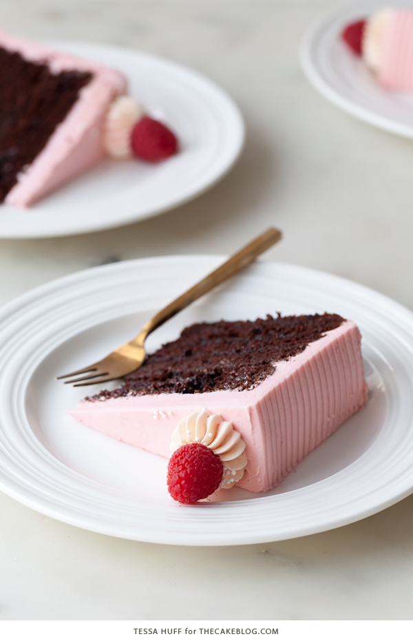 Chocolate Raspberry Cake - moist chocolate cake layered with raspberry jam, topped with raspberry cheesecake frosting and fresh red raspberries | by Tessa Huff for TheCakeBlog.com