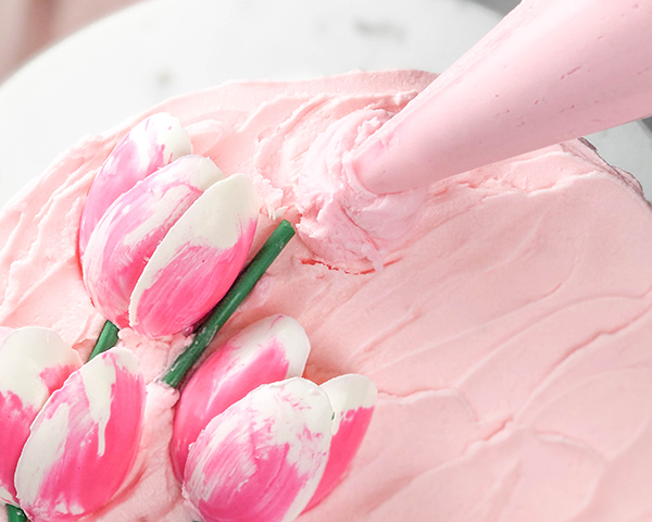 Chocolate Tulips - how to make gorgeous tulip cake decorations using melted chocolate and a plastic spoon | by Erin Gardner for TheCakeBlog.com