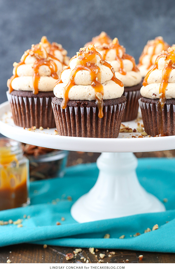 Chocolate Turtle Cupcakes - from scratch recipe for rich chocolate cupcakes with caramel pecan frosting, caramel drizzle and chopped pecans | by Lindsay Conchar for TheCakeBlog.com