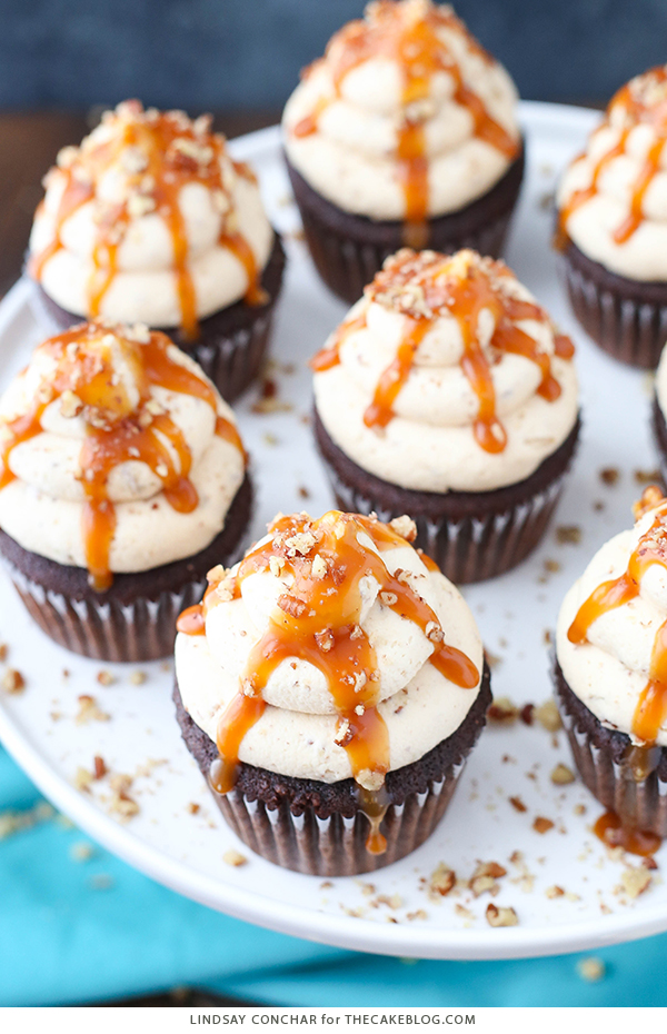 Chocolate Turtle Cupcakes - from scratch recipe for rich chocolate cupcakes with caramel pecan frosting, caramel drizzle and chopped pecans | by Lindsay Conchar for TheCakeBlog.com