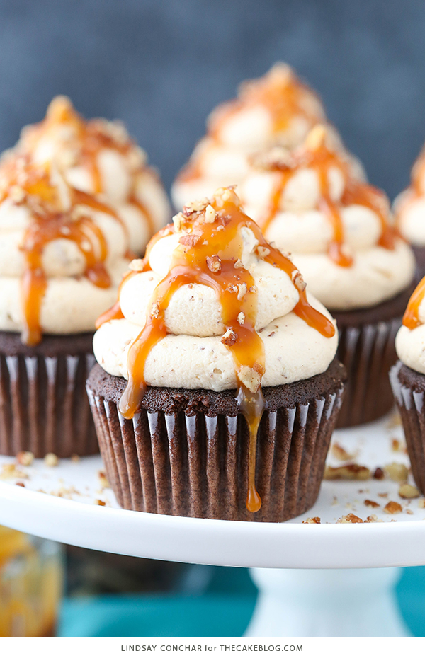 Chocolate Turtle Cupcakes - from scratch recipe for rich chocolate cupcakes with caramel pecan frosting, caramel drizzle and chopped pecans | by Lindsay Conchar for TheCakeBlog.com