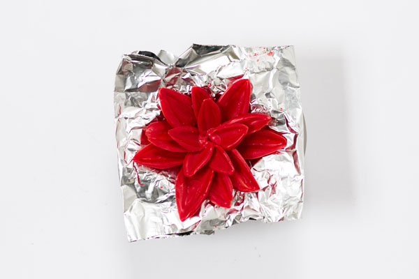 Chocolate Poinsettias - learn how to make these chocolate flowers with candy melts and a knife | Erin Gardner for TheCakeBlog.com