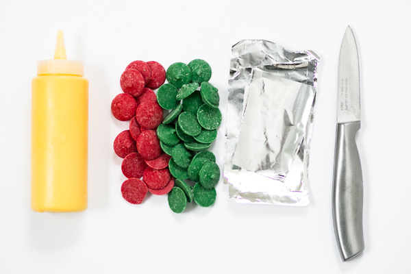 Chocolate Poinsettias - learn how to make these chocolate flowers with candy melts and a knife | Erin Gardner for TheCakeBlog.com