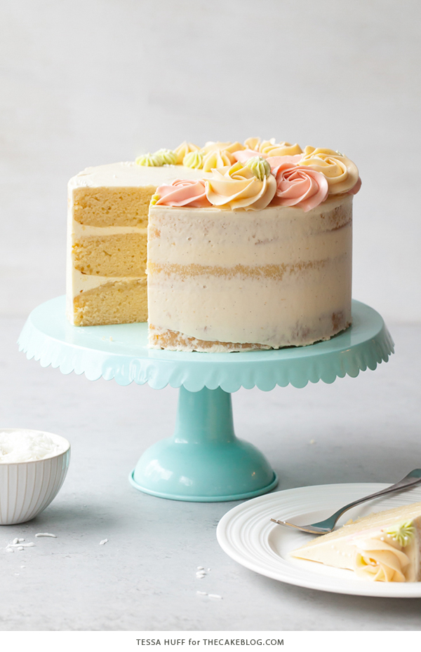 Coconut Cake - homemade coconut cake with creamy coconut milk, brushed with coconut syrup to keep it extra moist, and topped with vanilla bean buttercream frosting | by Tessa Huff for TheCakeBlog.com