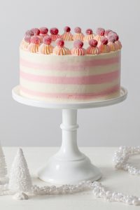 Cranberry Orange Spice Cake - citrus cake studded with tart cranberries and topped with white chocolate orange buttercream | by Tessa Huff for TheCakeBlog.com