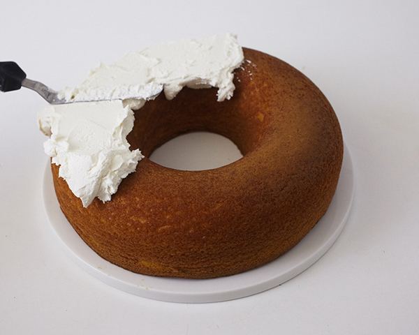 Easter Nest Cake - how to make a nest cake with roasted coconut and chocolate eggs for Easter dessert | by Cakegirls for TheCakeBlog.com