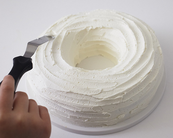 Easter Nest Cake - how to make a nest cake with roasted coconut and chocolate eggs for Easter dessert | by Cakegirls for TheCakeBlog.com