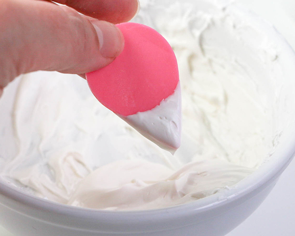 Flamingo Cake - how to make a pink flamingo cake topper using chocolate candy melts and brushstroke feathers | by Erin Gardner for TheCakeBlog.com