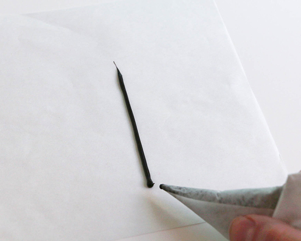 Flamingo Cake - how to make a pink flamingo cake topper using chocolate candy melts and brushstroke feathers | by Erin Gardner for TheCakeBlog.com