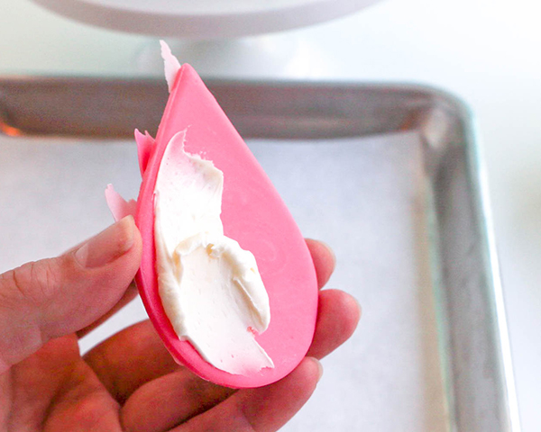 Flamingo Cake - how to make a pink flamingo cake topper using chocolate candy melts and brushstroke feathers | by Erin Gardner for TheCakeBlog.com