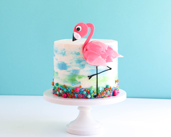 Flamingo Cake - how to make a pink flamingo cake topper using chocolate candy melts and brushstroke feathers | by Erin Gardner for TheCakeBlog.com
