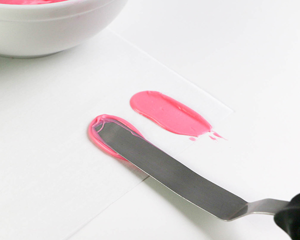 Flamingo Cake - how to make a pink flamingo cake topper using chocolate candy melts and brushstroke feathers | by Erin Gardner for TheCakeBlog.com