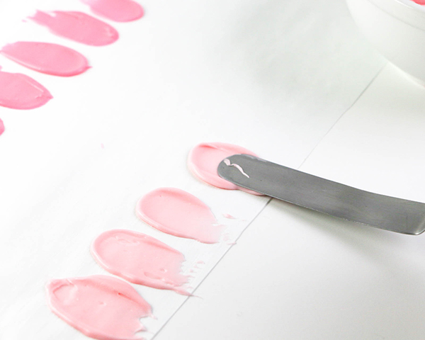 Flamingo Cake - how to make a pink flamingo cake topper using chocolate candy melts and brushstroke feathers | by Erin Gardner for TheCakeBlog.com