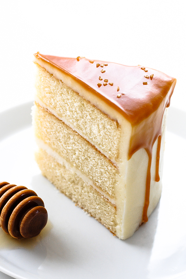 Honey Butter Cake | honey cake with honey cream cheese frosting topped with a honey butterscotch glaze | by Carrie Sellman for TheCakeBlog.com