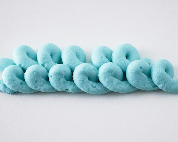 Winter Hat Cake - learn how to make this cozy cake that looks just like a knitted hat | by Cakegirls for TheCakeBlog.com