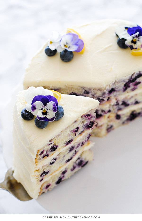 Lemon Blueberry Cake - lemon cake studded with wild blueberries, topped with lemon cream cheese frosting | by Carrie Sellman for TheCakeBlog.com