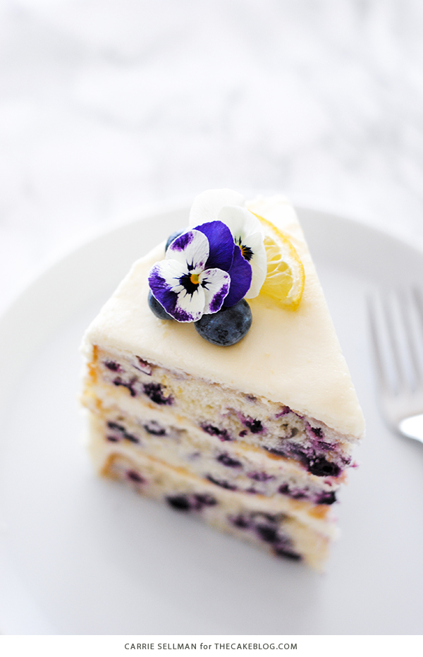 Lemon Blueberry Cake - lemon cake studded with wild blueberries, topped with lemon cream cheese frosting | by Carrie Sellman for TheCakeBlog.com