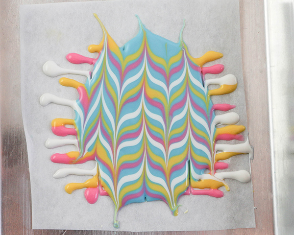 Marbled Chocolate Easter Eggs - how to make marbled Easter egg toppers for cakes and cupcakes using chocolate coating and cookie cutters | by Erin Gardner for TheCakeBlog.com