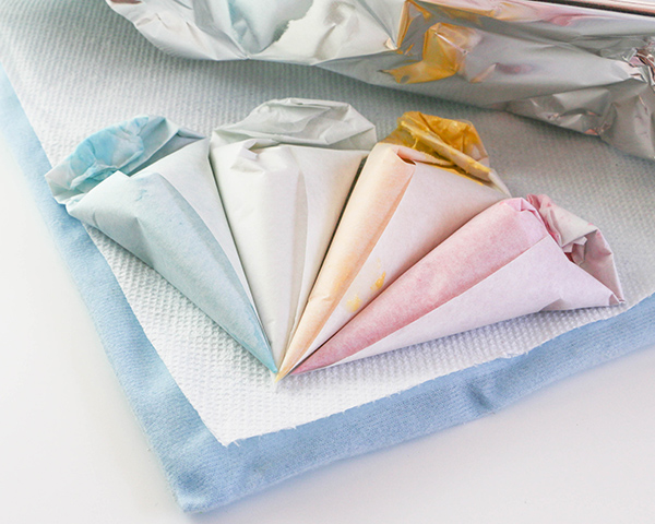 Marbled Chocolate Easter Eggs - how to make marbled Easter egg toppers for cakes and cupcakes using chocolate coating and cookie cutters | by Erin Gardner for TheCakeBlog.com