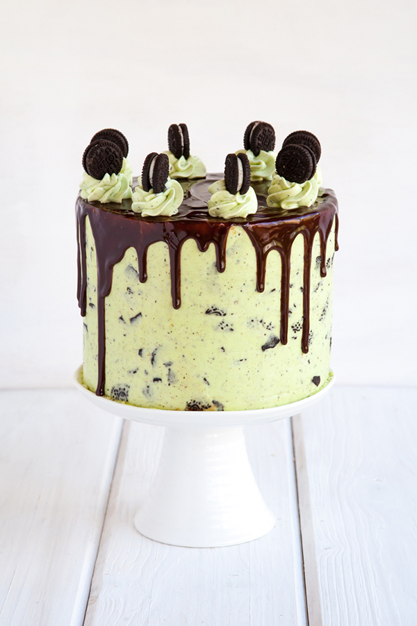 Mint Cookies 'N Cream Cake with crushed cookies in the cake and frosting plus a chocolate drip | by Tessa Huff for TheCakeBlog.com