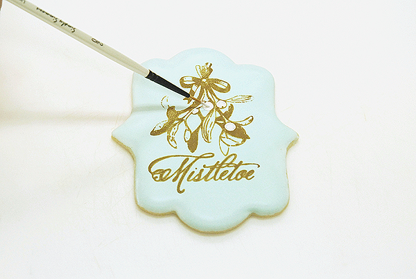 How to stencil-paint a cookie | Mistletoe Cookie Tutorial | by Robin Martin for TheCakeBlog.com