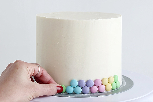 Pastel Rainbow M&M Cake | by Whitney DePaoli for TheCakeBlog.com