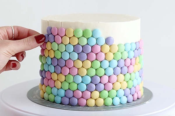 Pastel Rainbow M&M Cake | by Whitney DePaoli for TheCakeBlog.com