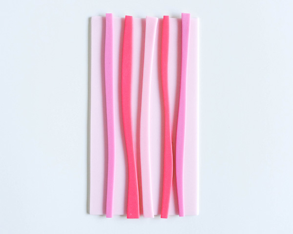 How to make striped heart toppers for cake and cupcakes | Tutorial by AK Cake Design for TheCakeBlog.com