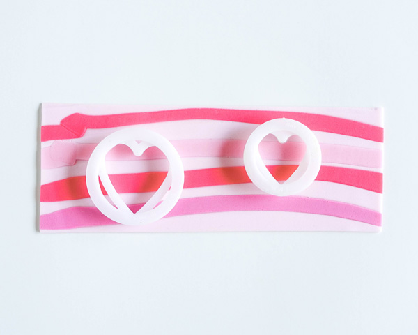 How to make striped heart toppers for cake and cupcakes | Tutorial by AK Cake Design for TheCakeBlog.com