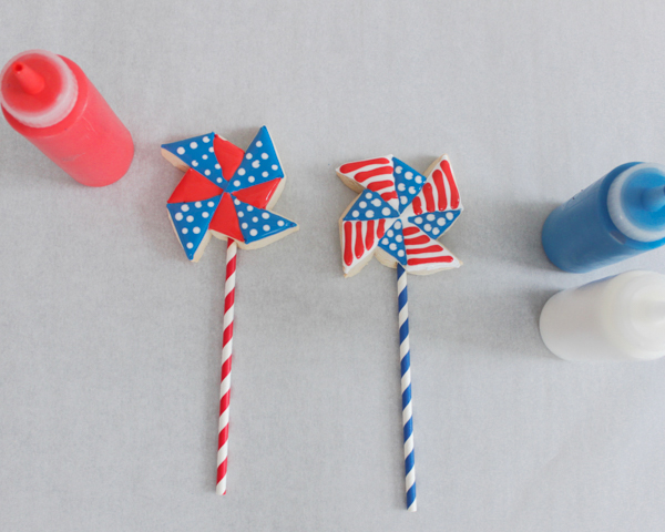 Pinwheel Cookies -- red, white and blue pinwheel cookies on a stick | by ellenJAY for TheCakeBlog.com