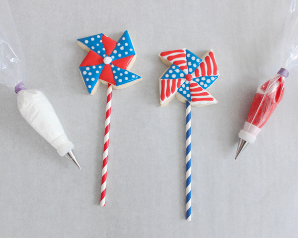 Pinwheel Cookies -- red, white and blue pinwheel cookies on a stick | by ellenJAY for TheCakeBlog.com