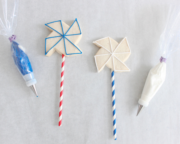 Pinwheel Cookies -- red, white and blue pinwheel cookies on a stick | by ellenJAY for TheCakeBlog.com