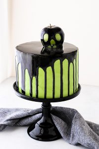 Poison Apple Cake - a black mirror glaze cake with an edible "poison apple" for Halloween | by Carrie Sellman for TheCakeBlog.com
