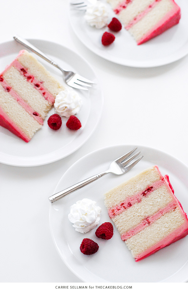 Raspberry Champagne Cake with raspberry drip glaze and fresh raspberries | by Carrie Sellman for TheCakeBlog.com