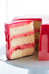 Raspberry Champagne Cake with raspberry drip glaze and fresh raspberries | by Carrie Sellman for TheCakeBlog.com